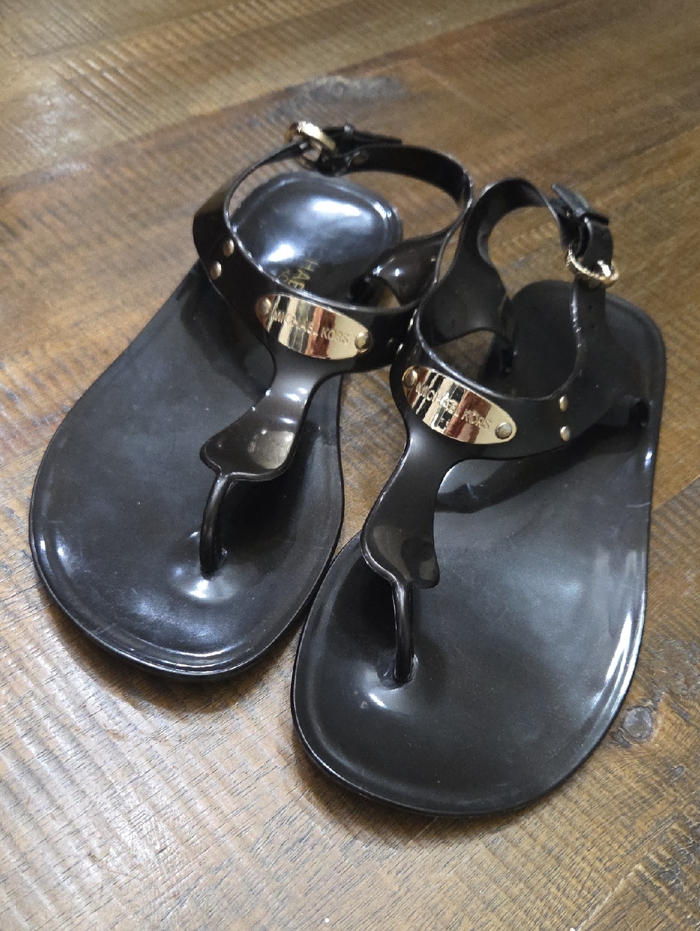 Michael Kors Black Patent Jelly Thong Sandals with Gold Plaque